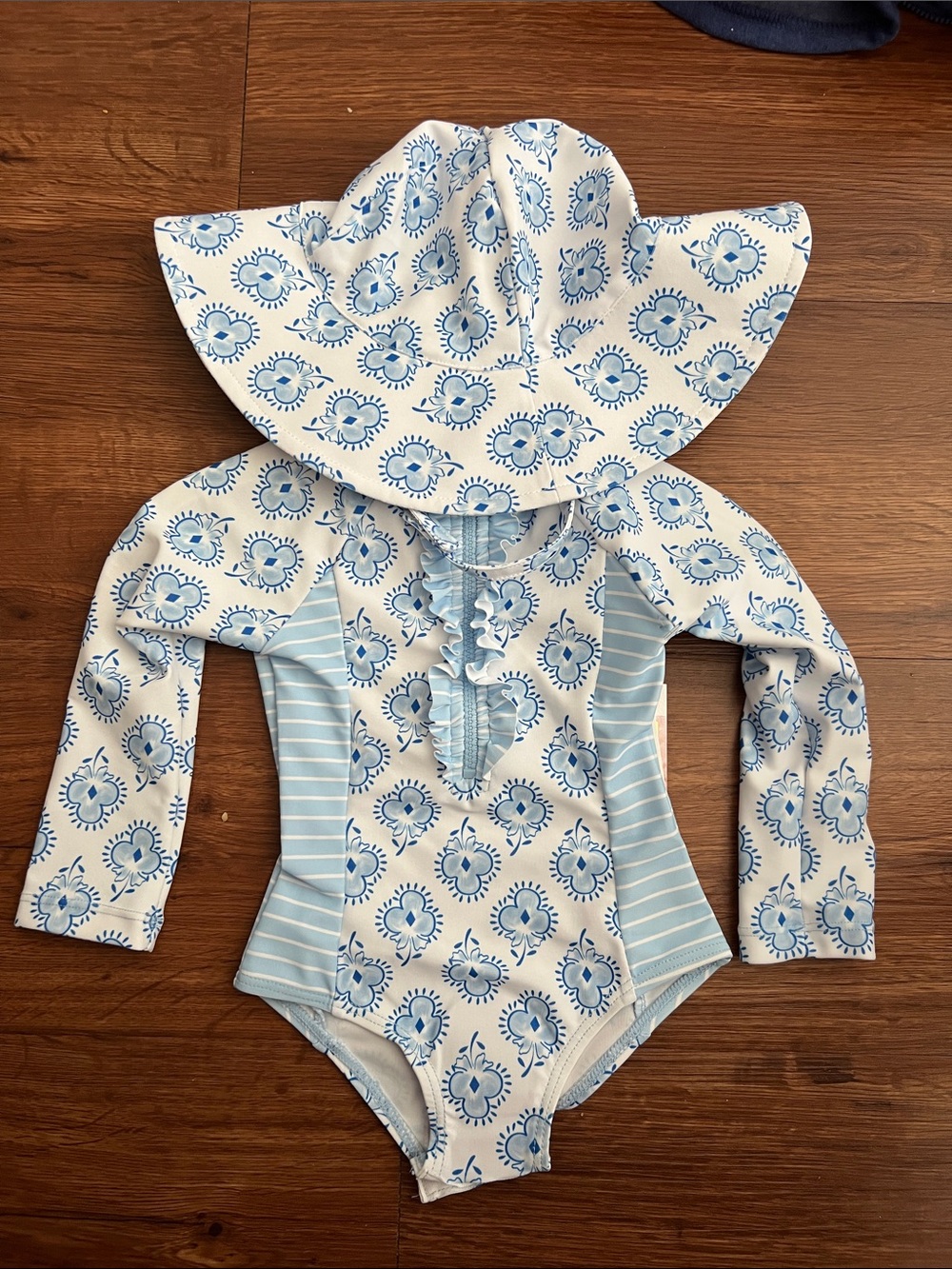 Baby girl bathing suit. Light Blue and White Floral Long-Sleeve One-Piece